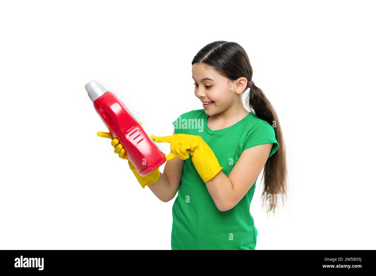 girl pointing at laundry detergent on background. photo of girl with ...