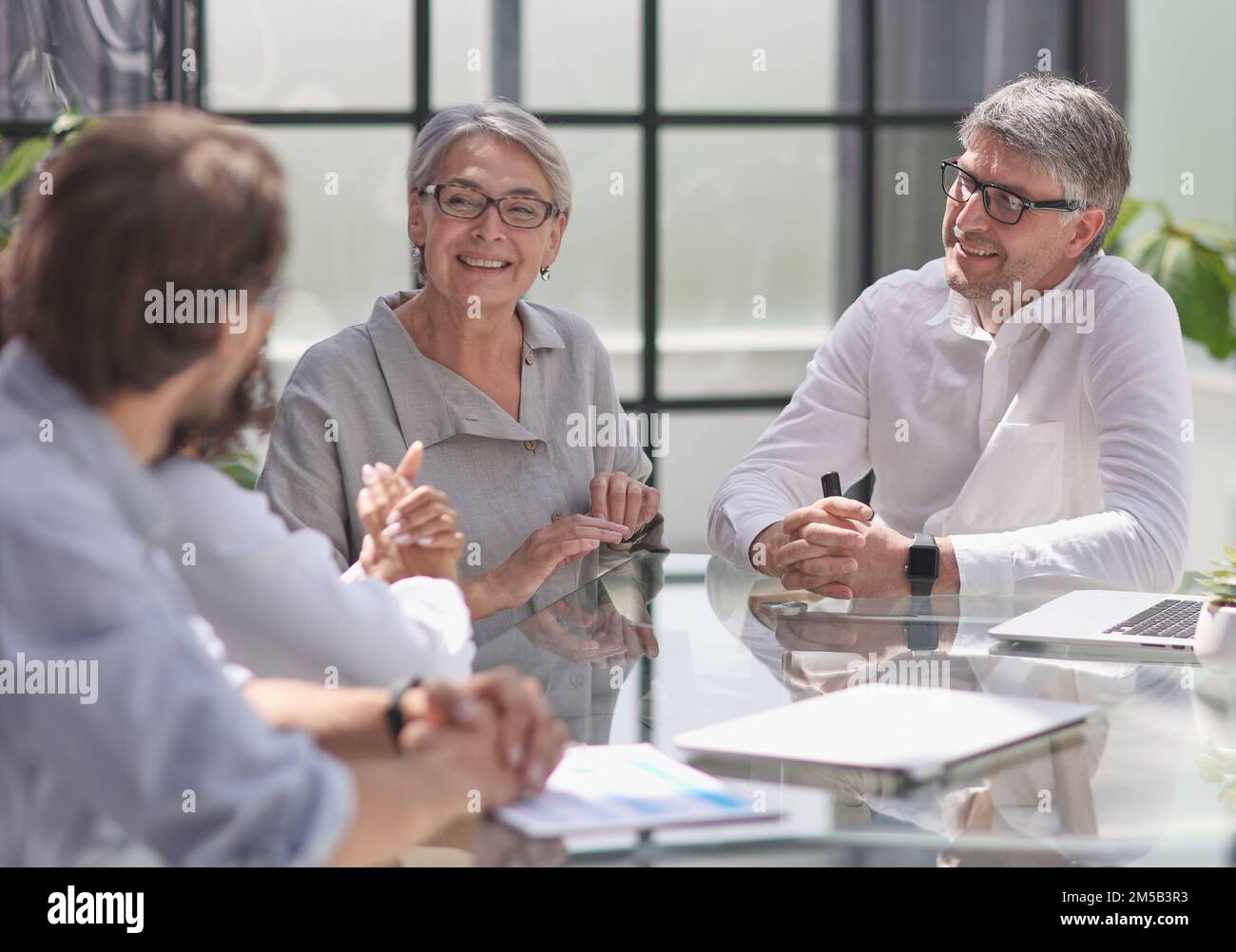 discussion of successful business people in the office Stock Photo