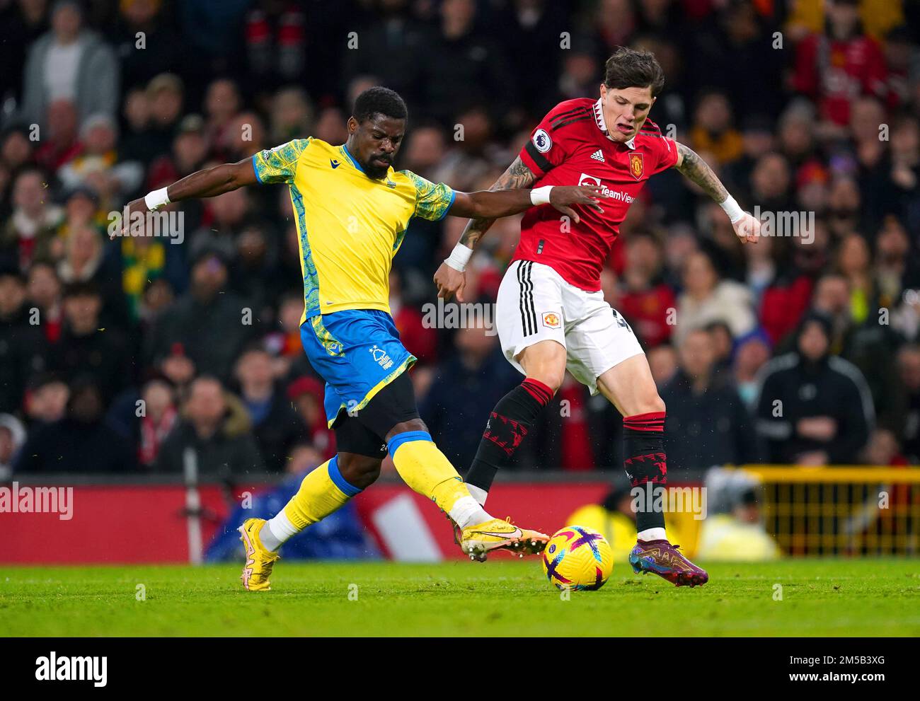 Nottingham Forest's Serge Aurier (left) and Manchester United's Alejandro Garnacho battle for the ball during the Premier League match at Old Trafford, Manchester. Picture date: Tuesday December 27, 2022. Stock Photo
