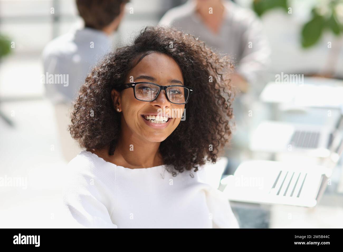 young attractive african american woman in the office Stock Photo - Alamy
