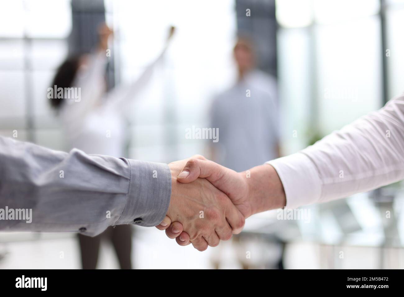 Businessman handshake for teamwork of business merger and acquisition Stock Photo