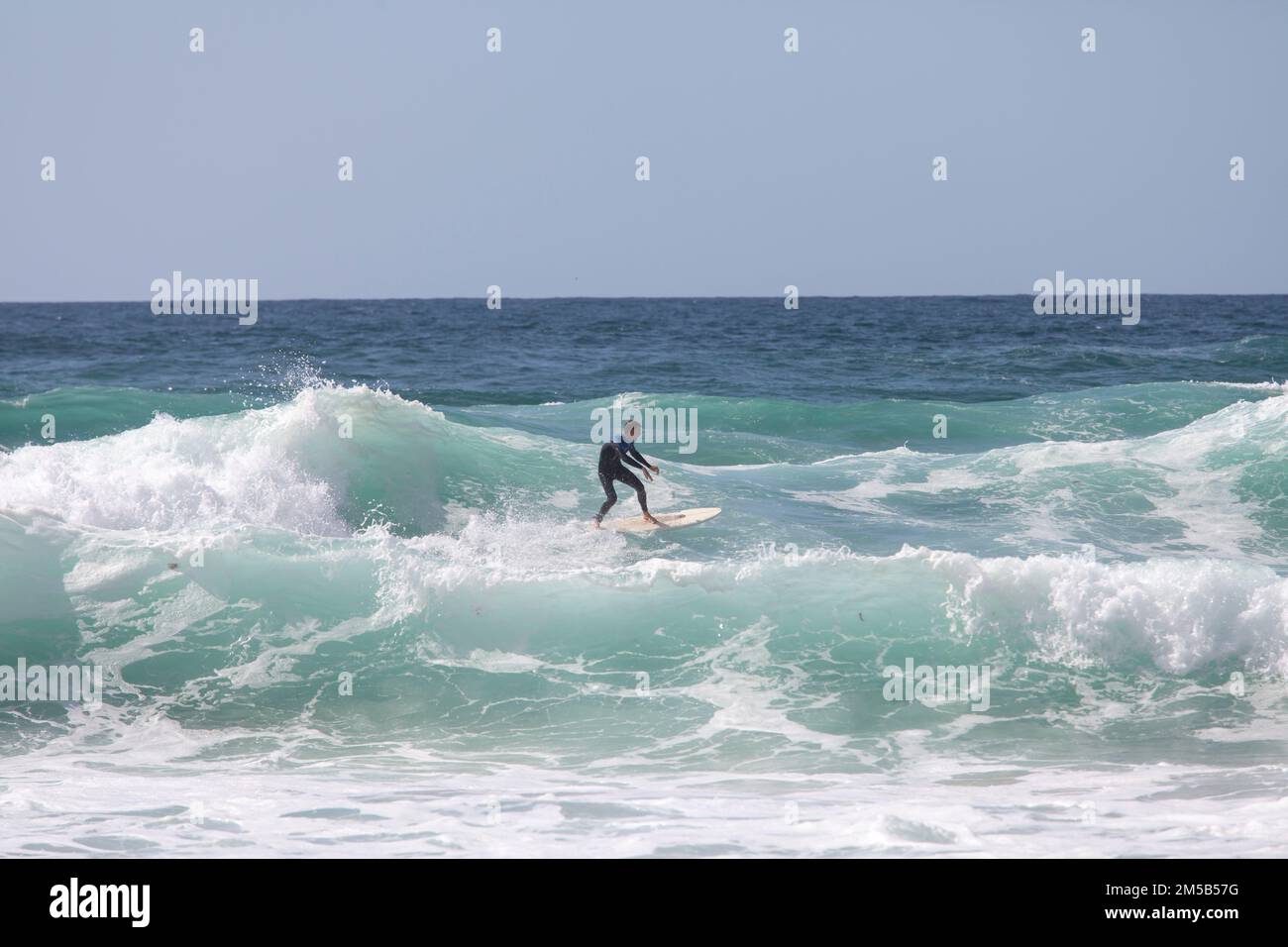 Padstow, Cornwall united kingdom September, 06 2012 Surfer riding on surfboard on ocean wave. Professional surfing in ocean on waves Stock Photo