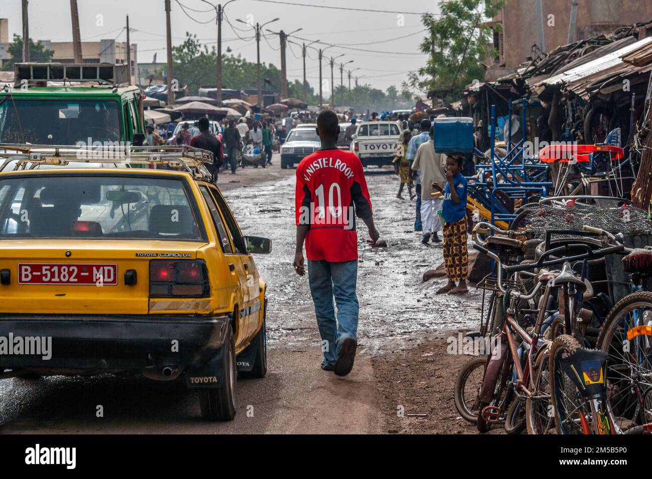 Local African boy with bright red Manchester United football shirt in Bamako ,Mali, West Africa. Stock Photo