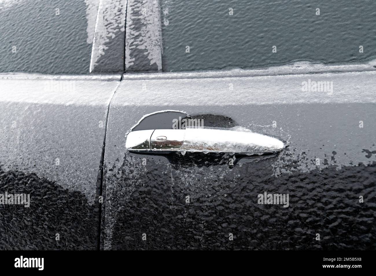 Frozen car from winter rains. Stock Photo