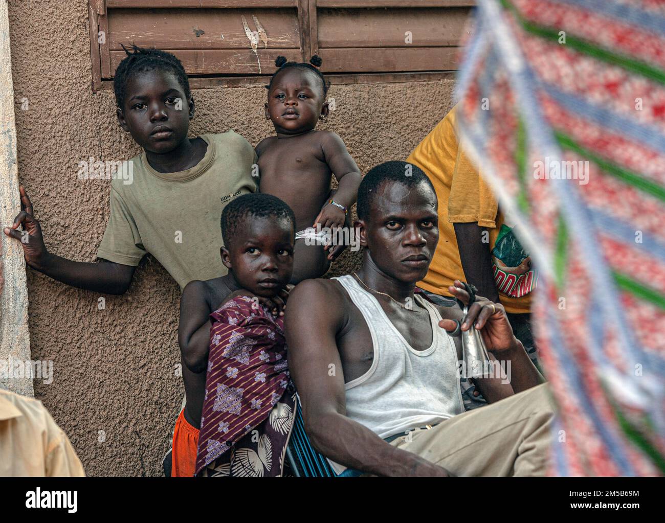 Family in front of their home in Bamako , Mali ,West Africa Stock Photo
