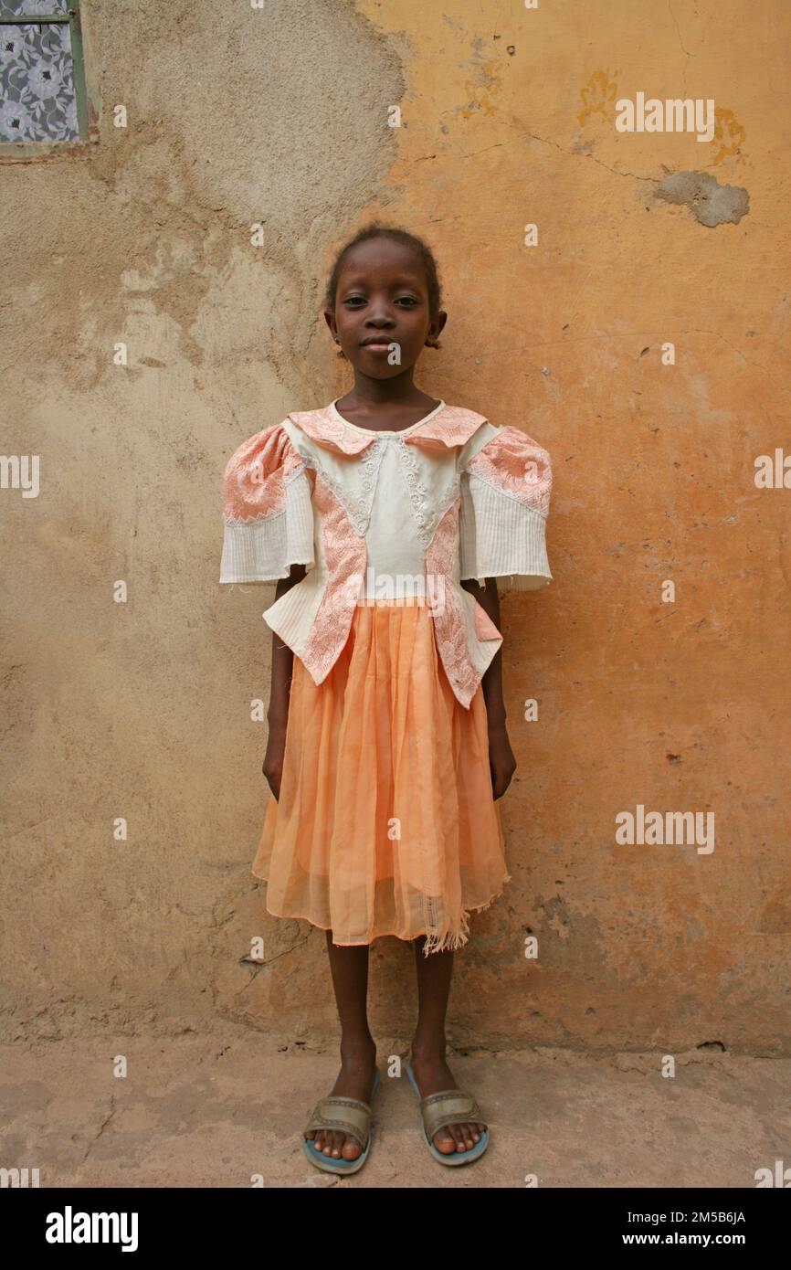 Young african girl in front of her home in Bamako,Mali ,West Africa. Stock Photo