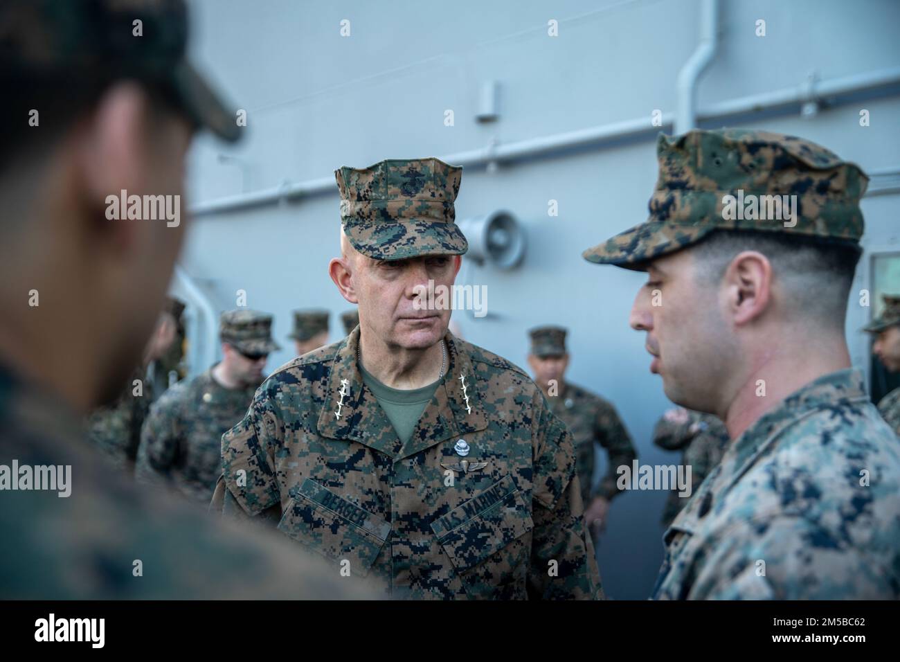 PEARL HARBOR (Feb. 20, 2022) U.S. Marine Corps Gen. David Berger, the Commandant of the Marine Corps, speaks to Marines and Sailors assigned to the 11th Marine Expeditionary Unit (MEU), during a distinguished visit aboard Wasp-class amphibious assault ship USS Essex (LHD 2), Feb. 20, 2022. Sailors and Marines of Essex Amphibious Ready Group (ARG) and the 11th MEU are visiting to Joint Base Pearl Harbor-Hickam while operating in U.S. 3rd Fleet. Stock Photo
