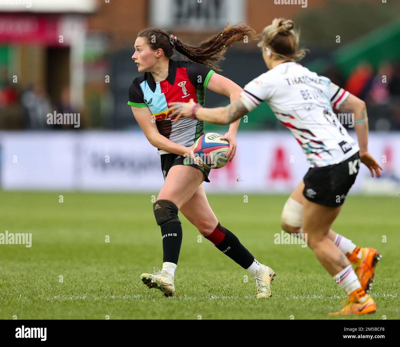 Lucy Packer of Harlequins Women runs with the ball during the Women