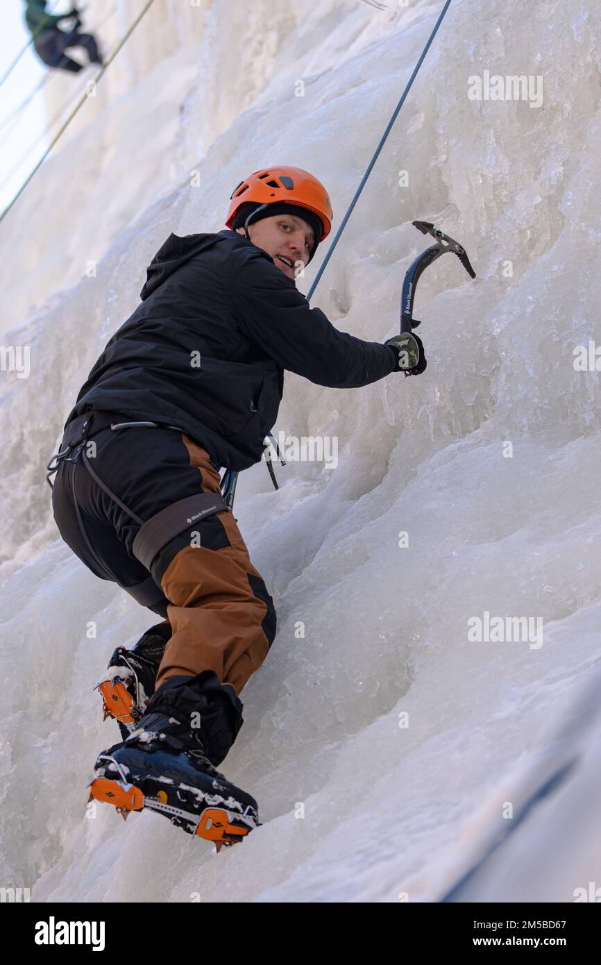 Cpl. Juan Zanella, an Army small arms/artillery repairer, assigned to 404th Aviation Support Battalion, 4th Combat Aviation Brigade, 4th Infantry Division, poses for a photo while ice climbing during a Better Opportunities for Single Soldiers program and Outdoor Recreation Center ice climbing event, Feb. 18-19, 2022, at Ouray, Colorado. During the event, Soldiers learned how to work together as a team – ice climbing, tying knots and bonding with other Soldiers. Stock Photo