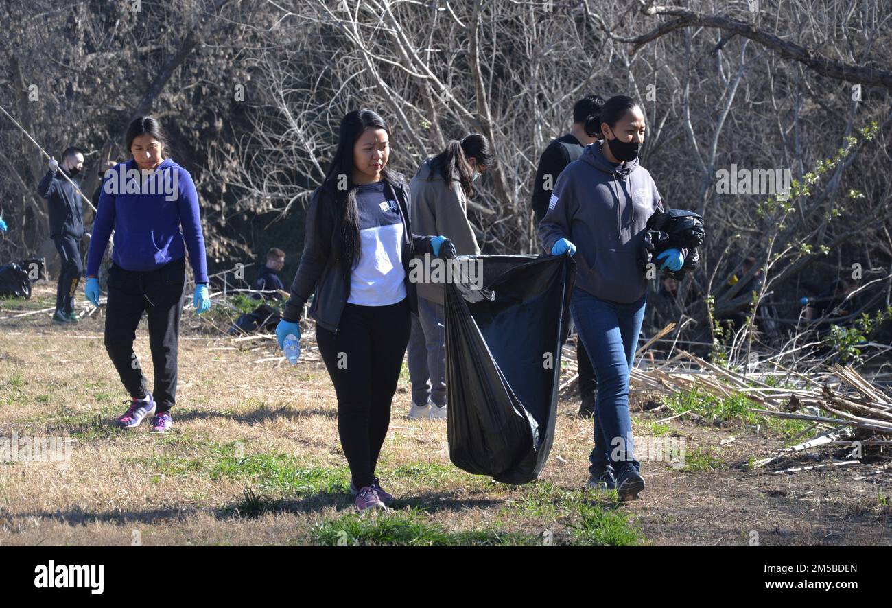 U.S. Navy Petty Officer 1st Class Mariegold Aloria (center) and Chief