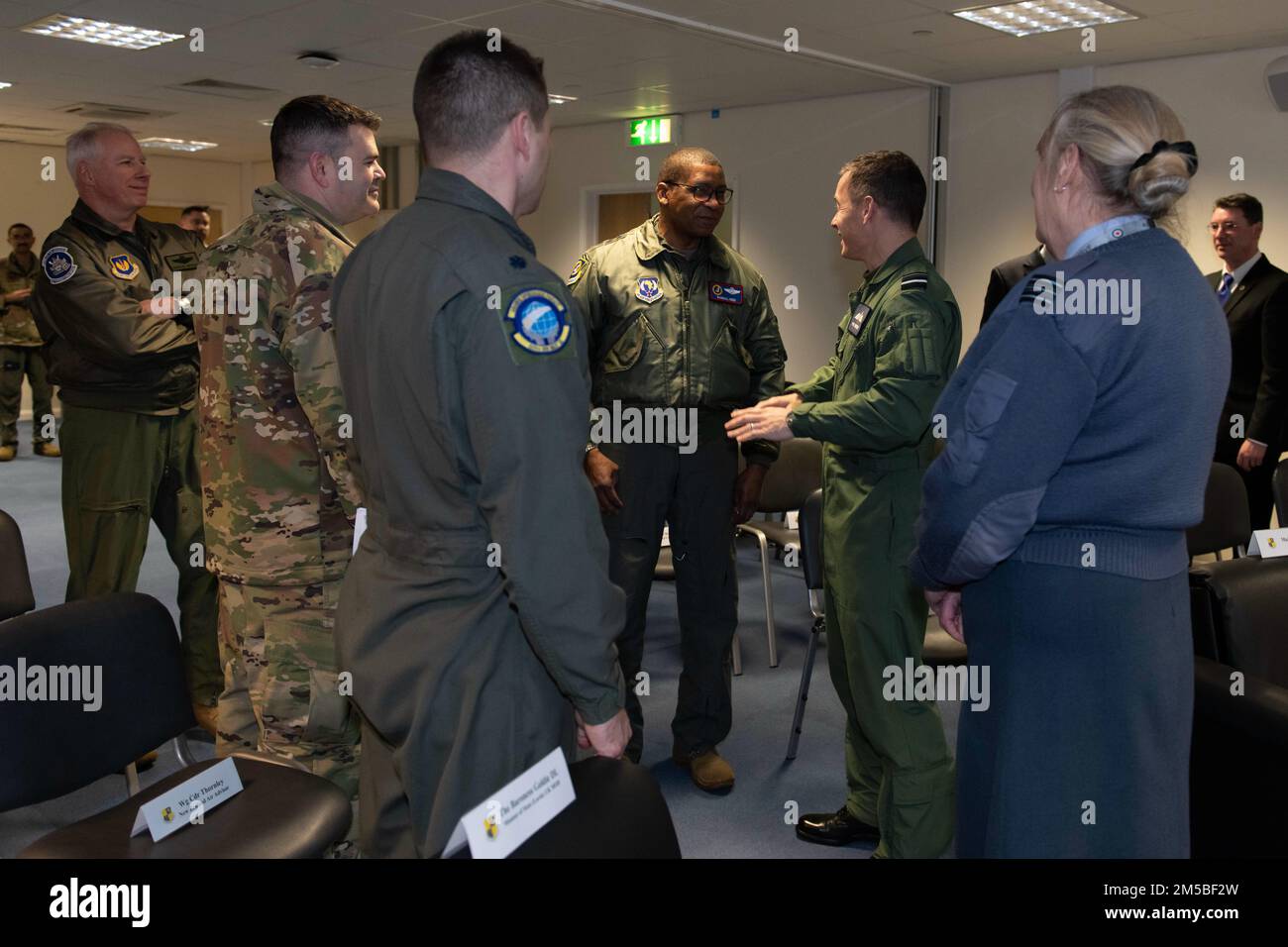 U.S. Air Force Maj. Gen. Randall Reed, center left, Third Air Force commander, greets Royal Air Force Air Vice-Marshall Phil Robinson CBE DFC, center right, Air Officer Commanding No. 11 Group, at RAF Fairford, England, Feb. 21, 2022. Reed was at Fairford to participate in briefings with representatives from allied nations about the capabilities and operations of U.S. Air Forces in the United Kingdom. Stock Photo