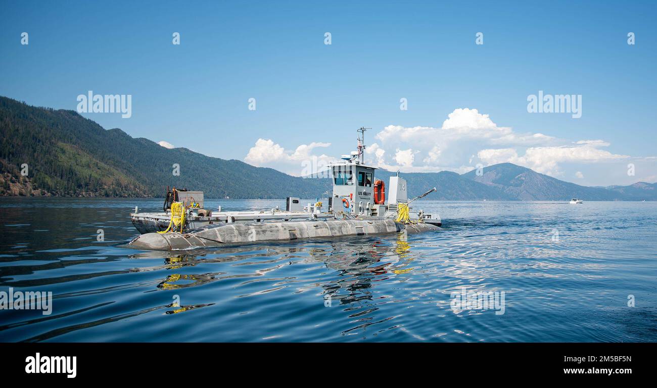 The Columbiaclass submarine model Pike is tugged through the waters of