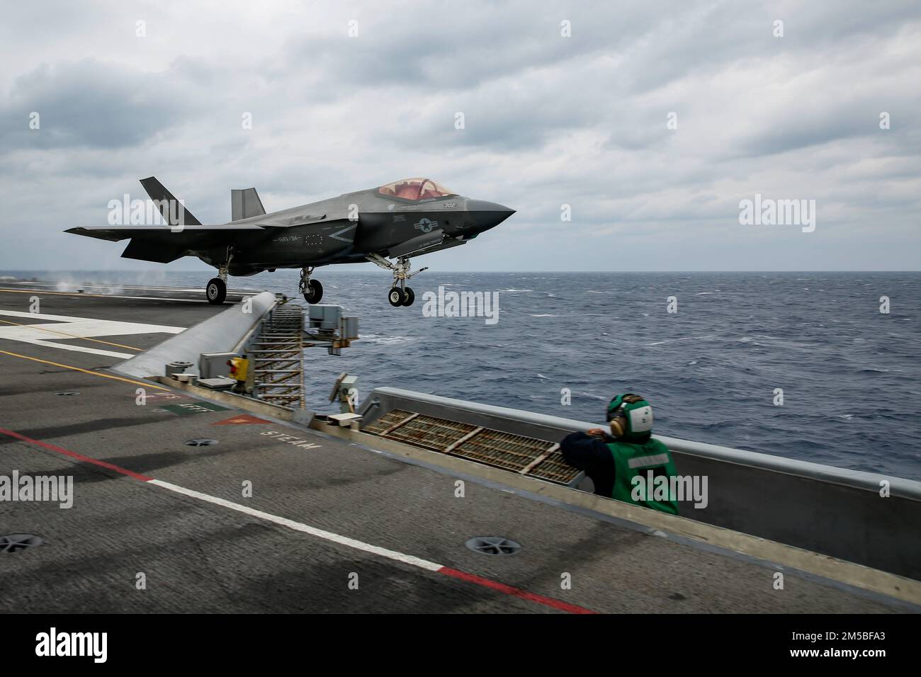 PHILIPPINE SEA (Feb. 22, 2022) An F-35C Lightning II, assigned to the 'Black Knights' of Marine Fighter Attack Squadron (VMFA) 314, launches from the flight deck of the Nimitz-class aircraft carrier USS Abraham Lincoln (CVN 72). Abraham Lincoln Strike Group is on a scheduled deployment in the U.S. 7th Fleet area of operations to enhance interoperability through alliances and partnerships while serving as a ready-response force in support of a free and open Indo-Pacific region. Stock Photo