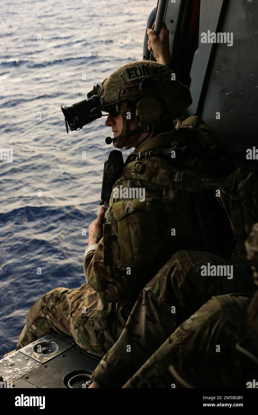 PHILIPPINE SEA (Feb. 22, 2022) Explosive Ordnance Disposal Technician 2nd Class Matthew Webb, from Cherryville, N.C., returns from training on a helicopter, visit, board, search and seizure (HVBSS) procedures. Abraham Lincoln Strike Group is on a scheduled deployment in the U.S. 7th Fleet area of operations to enhance interoperability through alliances and partnerships while serving as a ready-response force in support of a free and open Indo-Pacific region. Stock Photo