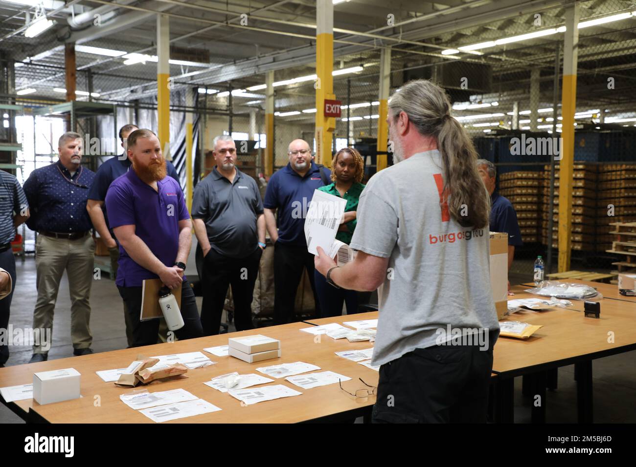 Warehouse manager, Gregory Autrand, demonstrates proper procedure