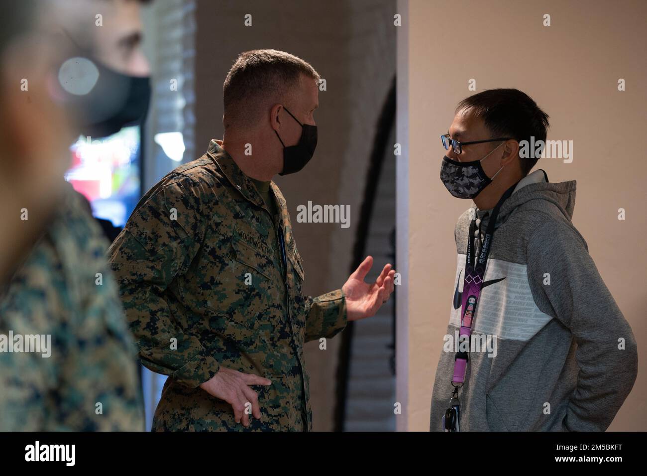 U.S. Marine Brig. Gen. Jason Woodworth, the commanding general of Marine Corps Installations West, Marine Corps Base Camp Pendleton, answers questions for a Camp Pendleton resident at the Base Housing Quality of Life open house at Marine Corps Family Team Building Center on Marine Corps Base Camp Pendleton, California, Feb. 23, 2022. The open house was held to increase awareness of current procedures, services and various resources available to residents along with addressing housing related questions or concerns. Stock Photo
