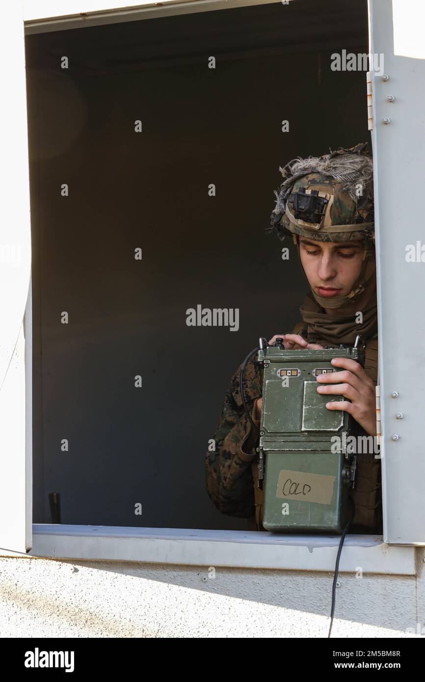 U.S. Marine Corps Lance Cpl. Kole Haynes, a radio operator with Golf Co., 2d Battalion, 5th Marine Regiment (2/5), 1st Marine Division, programs an AN/PRC-117G radio at Marine Corps Base Camp Pendleton, California, Feb. 22, 2022. The Marines of 2/5 participated in an embassy reinforcement exercise organized by Expeditionary Operations Training Group in order to ensure Marines who are preparing to deploy are ready for complex combat situations. Stock Photo