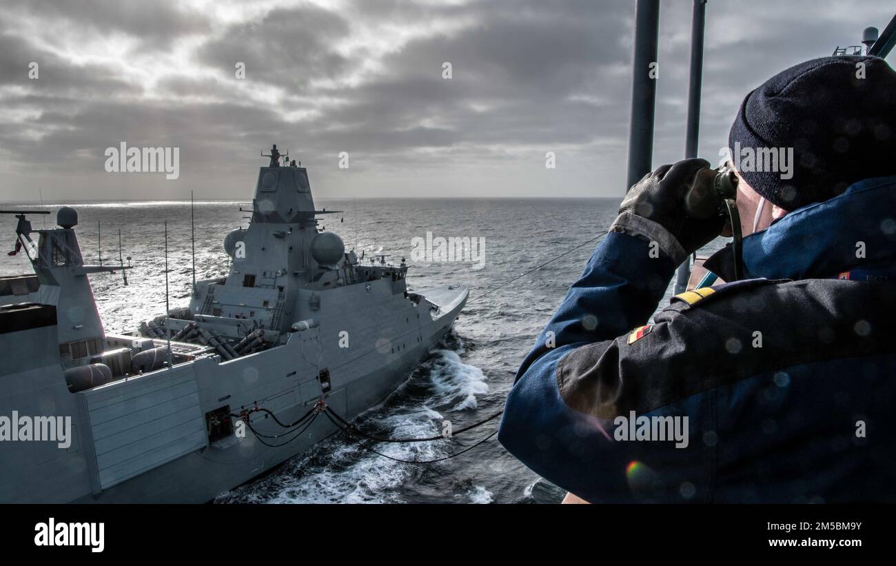 NORTH SEA (Feb. 23, 2022) Royal Danish Navy HDMS Peter Willemoes (F362) conducts a replenishment-at-sea with Standing NATO Maritime Group 1 flagship German Navy FGS Berlin (A1411) in the North Sea during Exercise Dynamic Guard 22, Feb. 23, 2022. Dynamic Guard is a bi-annual, multinational maritime electronic warfare exercise series designed to provide tactical training, and help build and maintain electroinic warfare and anti-ship missile defence for the NATO Response Force and NATO national units. Royal Netherlands Navy photo by Lt. Joelle Hoeksma. Stock Photo