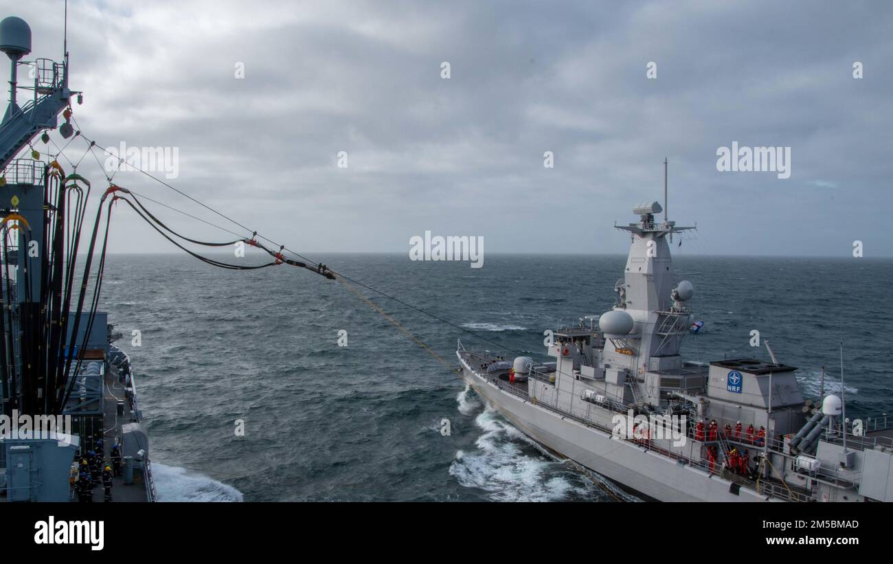 NORTH SEA (Feb. 23, 2022) Royal Netherlands Navy HNLMS Van Amstel (F831) conducts a replenishment-at-sea with Standing NATO Maritime Group 1 flaship German Navy FGS Berlin (A1411) in the North Sea during Exercise Dynamic Guard 22, Feb. 23, 2022. Dynamic Guard is a bi-annual, multinational maritime electronic warfare exercise series designed to provide tactical training, and help build and maintain electroinic warfare and anti-ship missile defence for the NATO Response Force and NATO national units. Royal Netherlands Navy photo by Lt. Joelle Hoeksma. Stock Photo