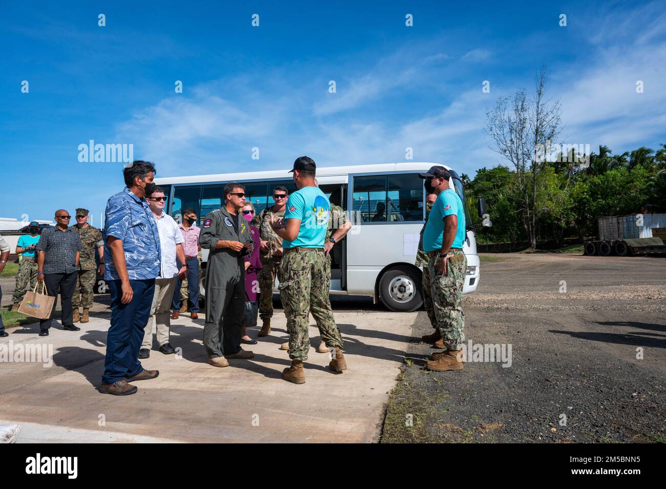 220223-N-XC372-7091 CAMP KATUU, Republic of Palau (Feb. 23, 2022) Adm. John C. Aquilino, Commander of U.S. Indo-Pacific Command, center, and Palau President Surangel Whipps Jr. arrive for a tour of Camp Katuu, hosted by members of the U.S. Civic Action Team (CAT) Palau 133-30. Aquilino visited Palau to discuss regional challenges and reaffirm the strong, longstanding commitment to supporting the people of Palau in combating COVID 19. Stock Photo