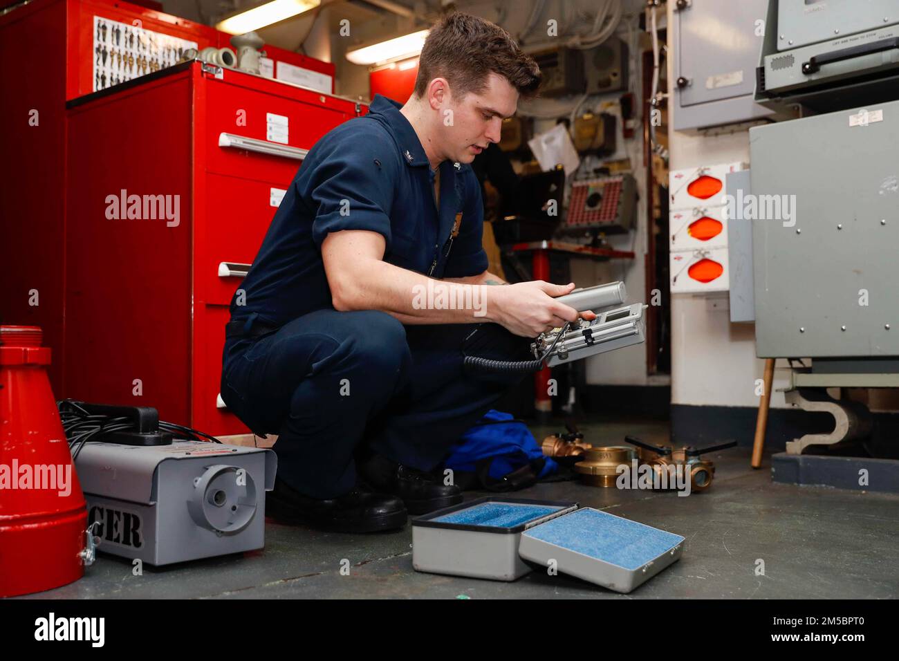 PHILIPPINE SEA (Feb. 24, 2022) Damage Controlman 3rd Class Danny Wallis, from Clifton, Texas, conducts maintenance on a radiacs in a repair locker aboard the Nimitz-class aircraft carrier USS Abraham Lincoln (CVN 72). Abraham Lincoln Strike Group is on a scheduled deployment in the U.S. 7th Fleet area of operations to enhance interoperability through alliances and partnerships while serving as a ready-response force in support of a free and open Indo-Pacific region. Stock Photo
