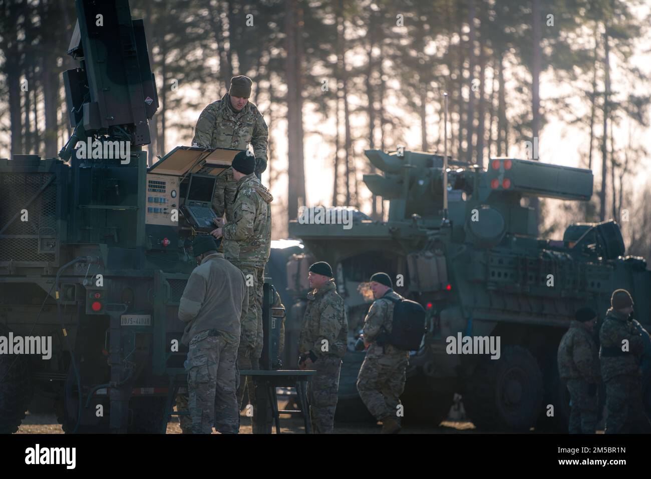 A U.S. Army Soldiers, assigned to 5th Battalion, 4th Air Defense Artillery Regiment, prepare a Sentinel radar for the day’s training during Exercise Saber Strike 22 at BPTA, Poland on February 24, 2022. During Saber Strike, 5-4 ADA Battalion is conducting a series of air & missile defense drills with NATO Allies Poland, Lithuana, Latvia, and Estonia. The exercise runs through March with approximately 13,000 participants from 13 countries. Saber Strike has been held every 2 years since 2010. U.S. Army photo by Maj. Robert Fellingham) Stock Photo
