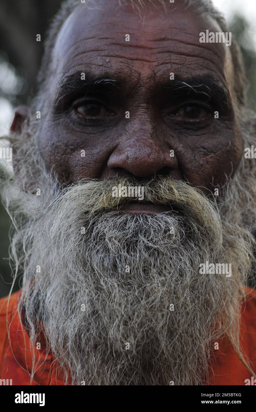 Skin texture. A sadhu on the Mallick Ghat by the Hooghly river in ...