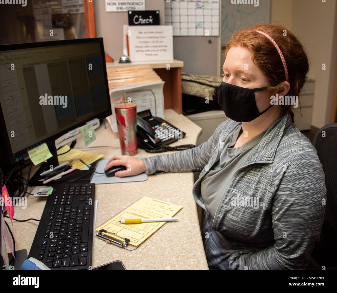 Heather Matix, medical support assistant, reviews the schedule for