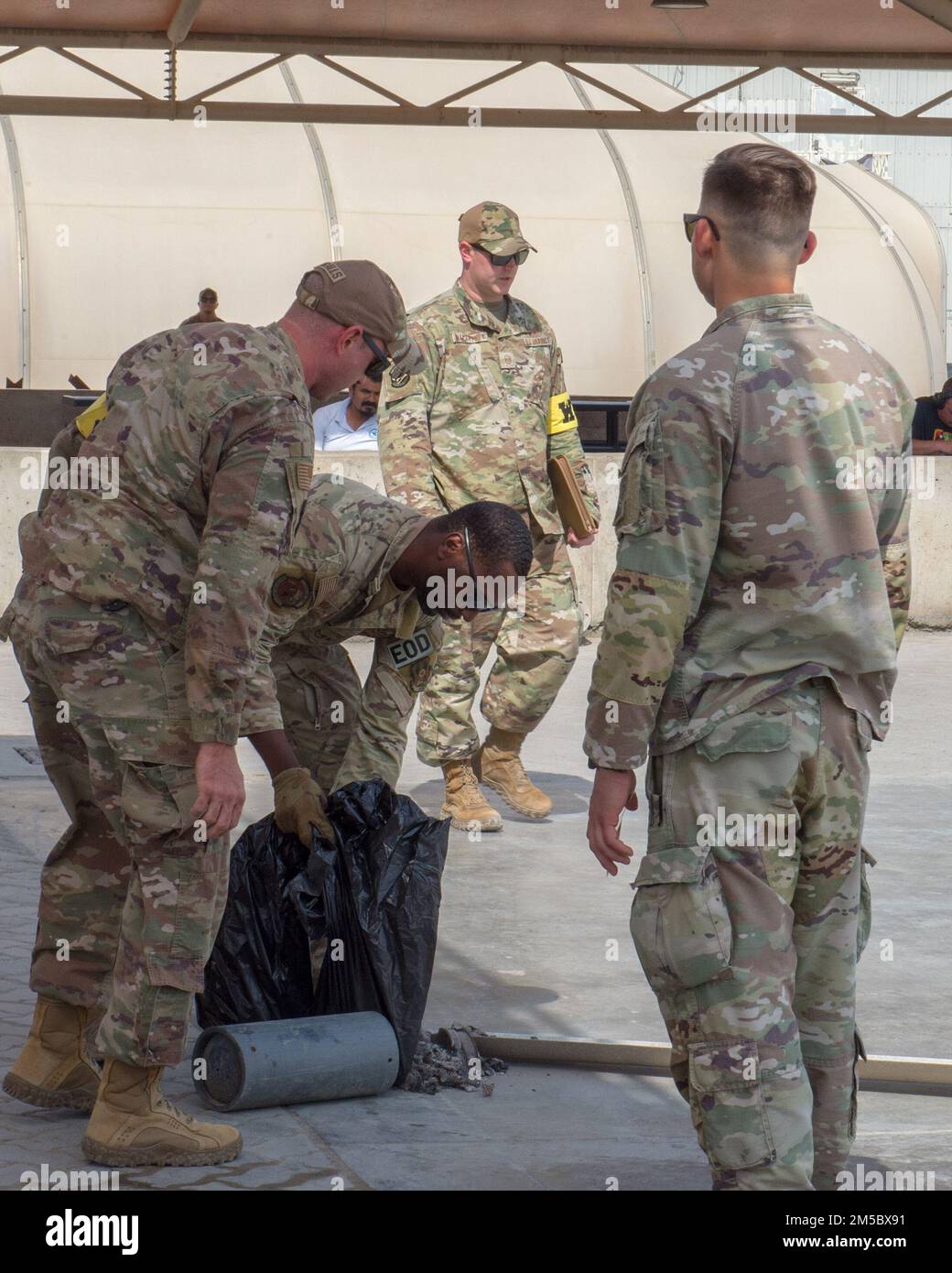 Members of the 380th Air Expeditionary Wing's inspection team simulate ...
