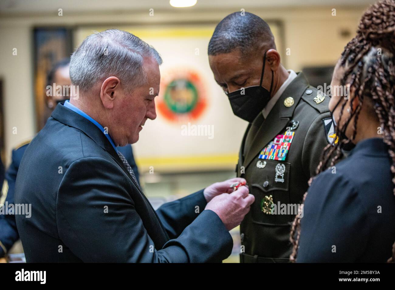 Gen. (R) John M. Murray pins Command Sgt. Maj. Michael A. Crosby's with The Distinguished Service Medal during an retirement ceremony that was held  at the III Armored Corps Headquarters in Fort Hood, Texas Feb. 25, 2022. On June 4 2018 Crosby was assigned to the Army Futures Command as the first command sergeant major, Crosby have fostered and galvanized numerous modernization activities during his time at AFC, including but not limited to the creation of Project Convergence, the Army’s campaign of learning and experimentation; the founding of the Army Applications Laboratory, Army Software F Stock Photo