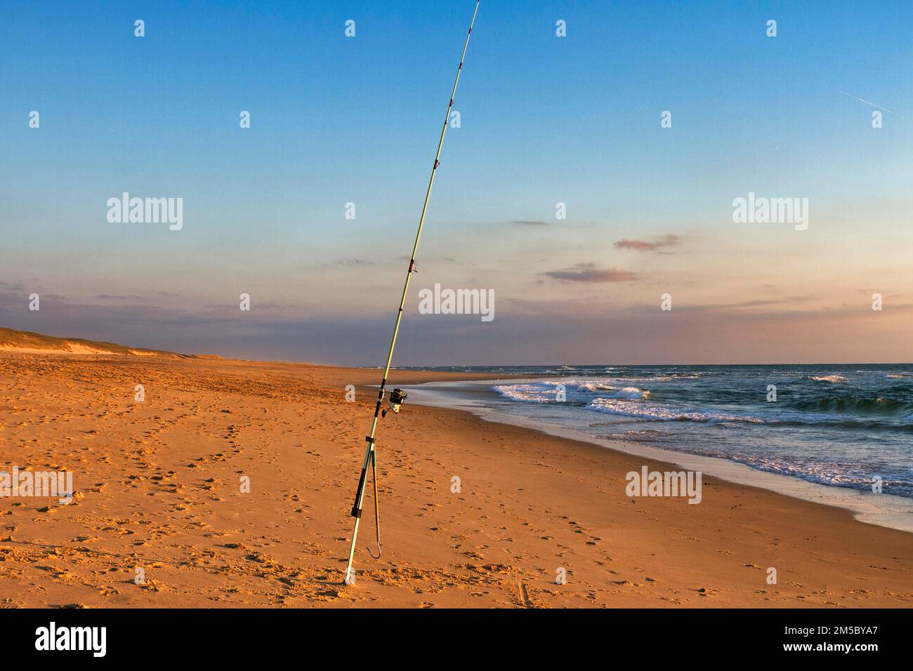 Surf fishing, fishing rod stands on the beach, Soustons Plage