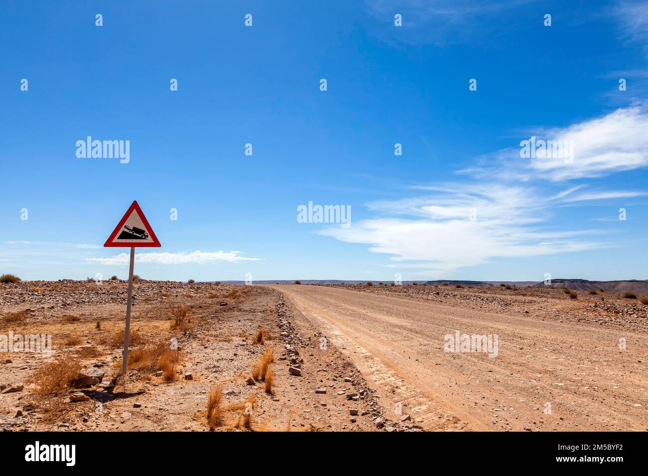Traffic sign with warning, gravel road, Namibia Stock Photo Alamy