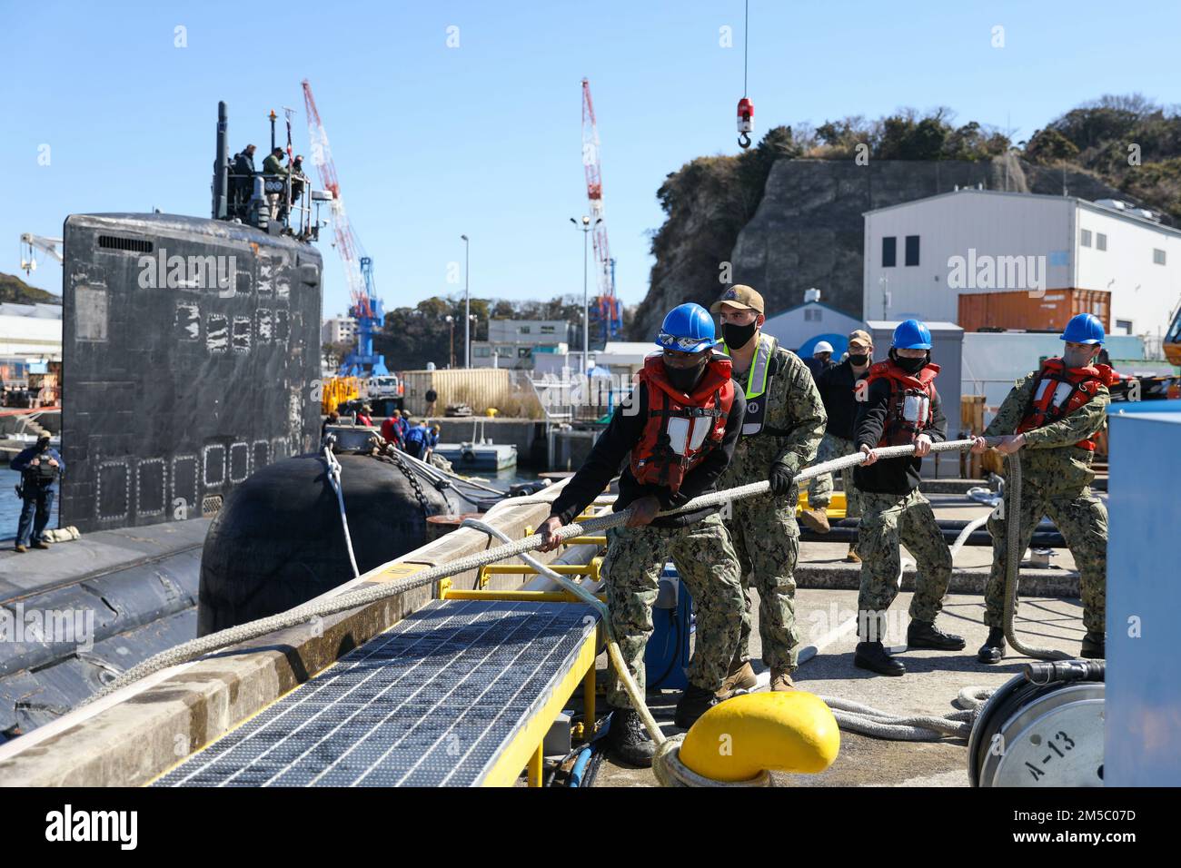 YOKOSUKA, Japan (Feb. 25, 2022) Linehandlers from Commander, Submarine ...