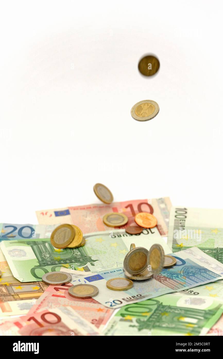 Euro Coins Raining Euro coins fall on euro banknotes, rain of money, high cost, symbolic ...