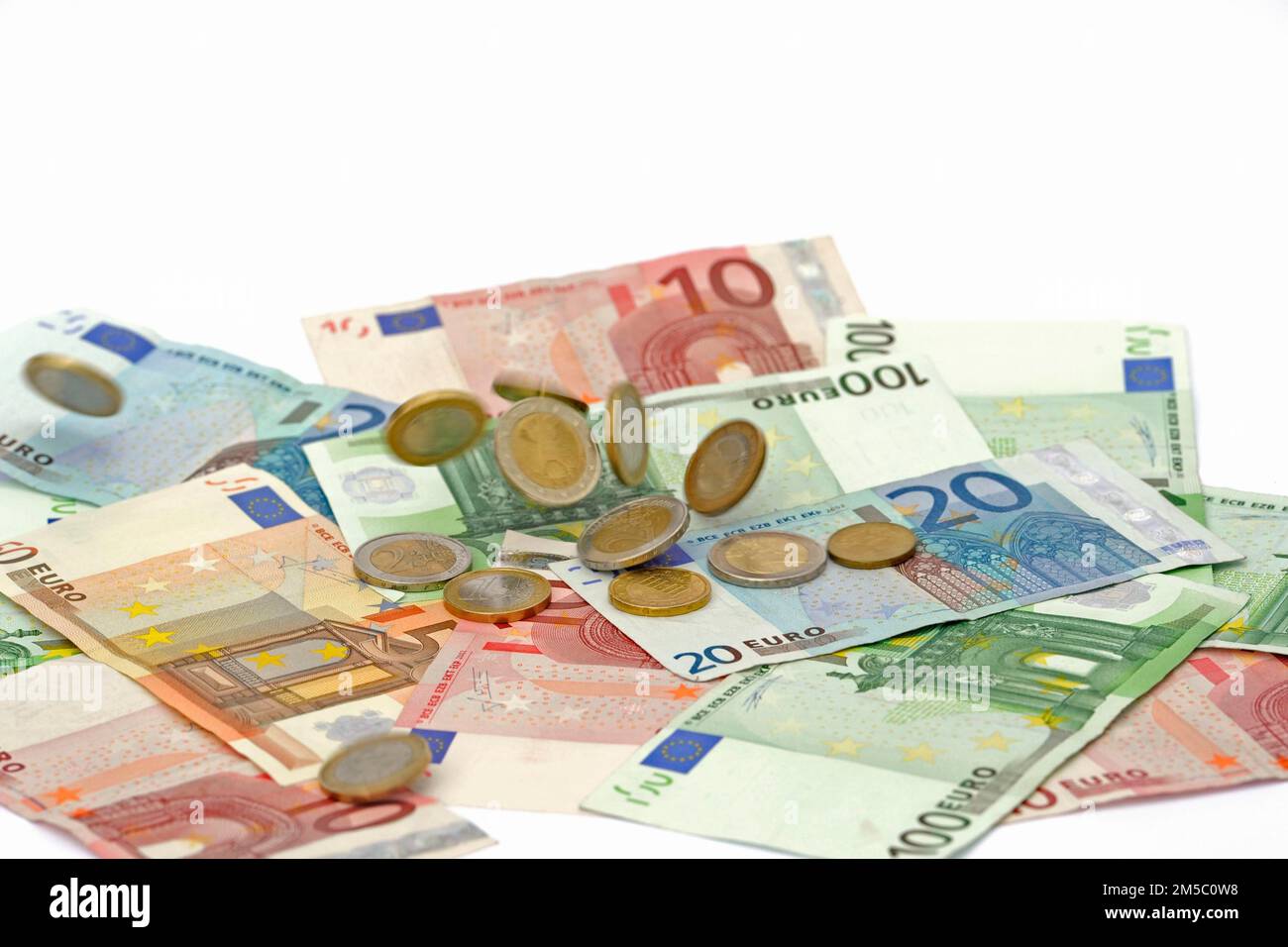Euro Coins Raining Euro coins fall on euro banknotes, rain of money, high cost, symbolic ...