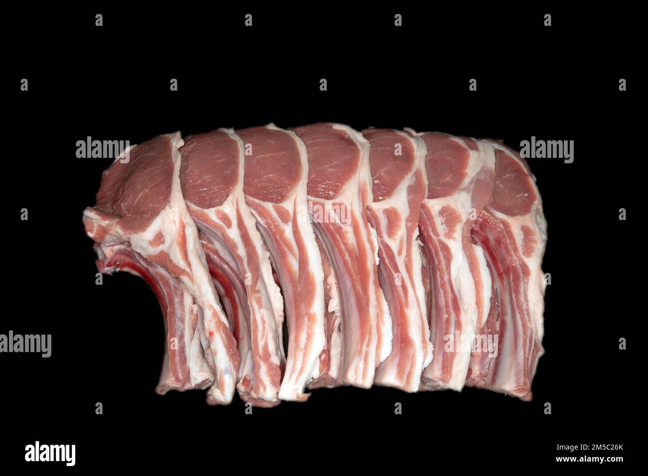 Freshly cut lamb chops, food photography with black background Stock