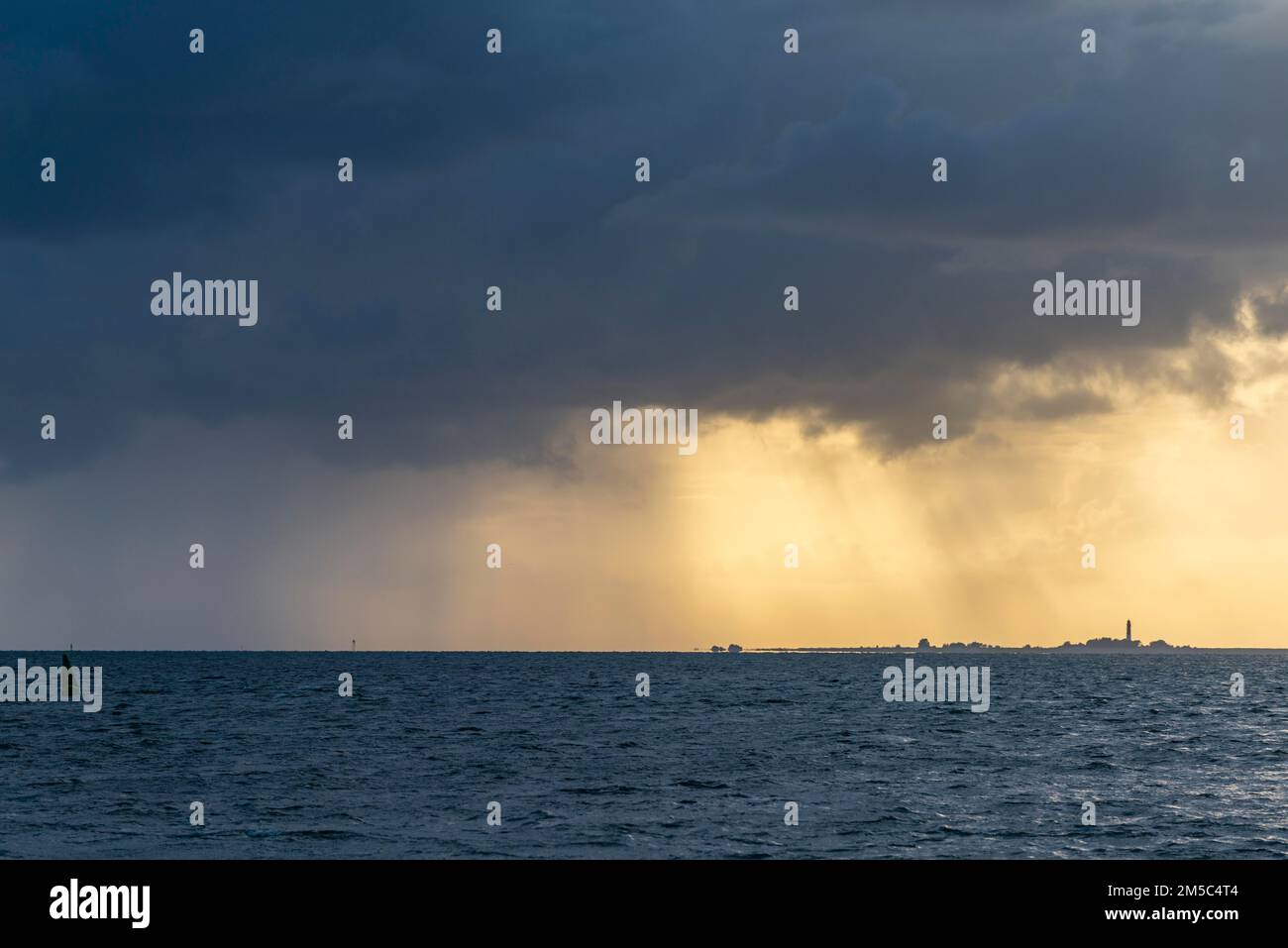 North Sea island of Pellworm in the evening light, seen from the peninsula of Nordstrand, backlight, North Frisia, Schleswig-Holstein, Germany Stock Photo