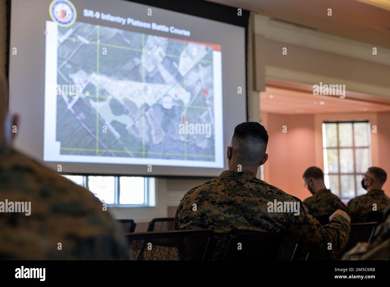 U.S Marines with II Marine Expeditionary Force attend the warfighter training symposium event at Marston Pavilion, Marine Corps Base Camp Lejeune, North Carolina, Feb. 28, 2022. The warfighter training symposium educated unit leaders across MCB Camp Lejeune on range modernization efforts, development of new ranges and highlighted other training opportunities and systems available on the installation. Stock Photo
