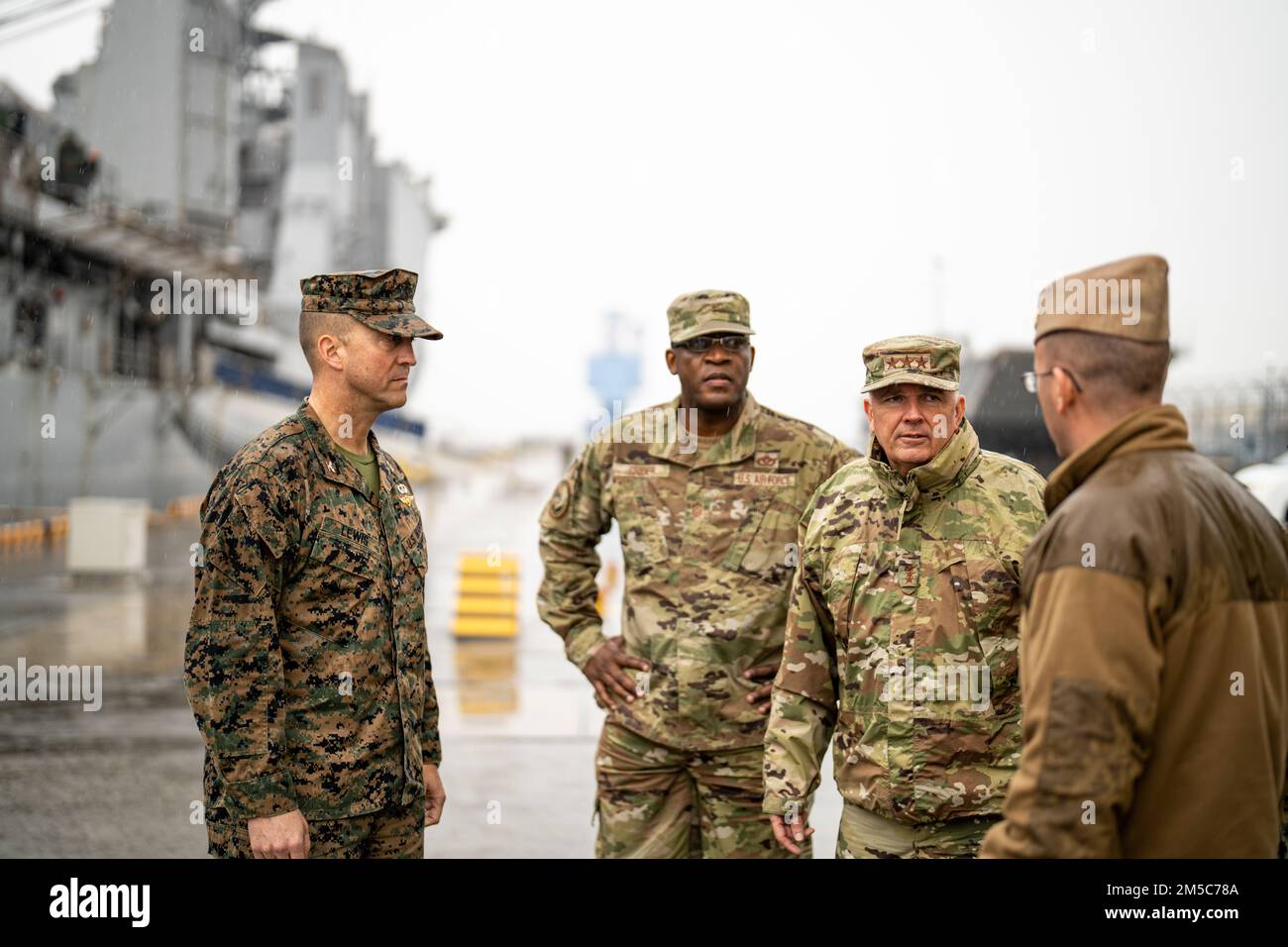 U.S. Air Force Lt. Gen. Ricky N. Rupp, commander of United States Forces Japan, discusses harbor operations with Chief Juan Vigil, the harbor master at Marine Corps Air Station Iwakuni, Japan, March 1, 2022. Rupp visited MCAS Iwakuni to better understand the air station’s commitment to the U.S.-Japan alliance and level of military readiness. During the last year, the air station hosted both the JS Izumo and USS America, demonstrating the bilateral capabilities of its deep-water port. MCAS Iwakuni is an advanced naval base which provides positional advantage, strengthened strategic alliances, a Stock Photo