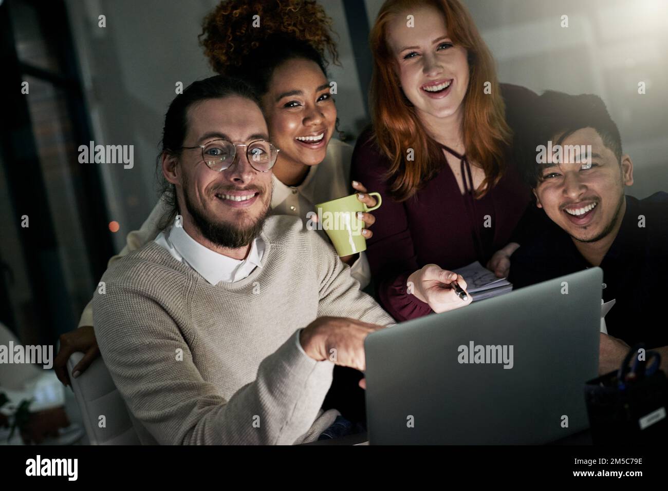 Were the design team you need. Portrait of a group of young designers working late in the office. Stock Photo