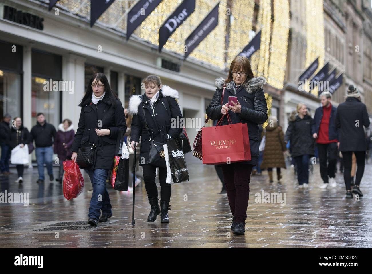 File photo dated 17/12/17 of shoppers on Buchanan Street in Glasgow city centre. Scotland's retail sector can thrive in the year ahead, a leading industry figure insisted, as he raised concerns about the impact of tax rises north of the border and the new deposit return scheme for drinks cans and bottles. David Lonsdale, director of the Scottish Retail Consortium (SRC), said decisions in the Scottish budget to freeze income tax thresholds and to increase charges for higher earners were 'likely to take a bite out of consumer spending at a time when retail sales are set to remain sluggish'. Issu Stock Photo