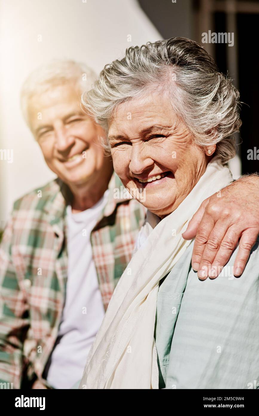 Hes my hubby and he makes me happy. a happy senior couple relaxing together outdoors. Stock Photo
