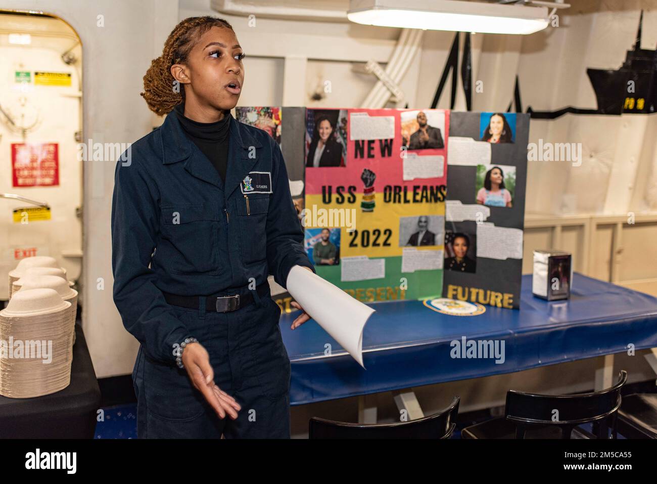 220228-N-XB010-1013 EAST CHINA SEA (Feb. 28, 2022) Logistics Specialist Seaman Cicely Flowers presents a speech during a Black History Month presentation by USS New Orleans’ (LPD 18) Diversity Committee. New Orleans, part of the America Amphibious Ready Group, along with the 31st Marine Expeditionary Unit, is operating in the U.S. 7th Fleet area of responsibility to enhance interoperability with allies and partners and serve as a ready response force to defend peace and stability in the Indo-Pacific region. Stock Photo