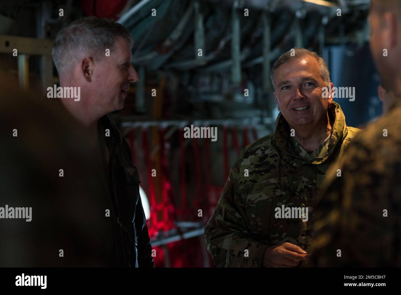 U.S. Air Force Lt. Gen. Ricky N. Rupp, right, commander of the United States Forces Japan, speaks with U.S. Marines with Marine Aerial Refueler Transport Squadron 152 during a KC-130 visit at Marine Corps Air Station (MCAS) Iwakuni, Japan, March 1, 2022. Rupp visited squadrons at MCAS Iwakuni to better understand the air station’s commitment to the U.S.-Japan alliance and level of military readiness. MCAS Iwakuni is an advanced naval base which provides positional damage, strengthened strategic alliances, and support to fleet operations and naval campaigns. Stock Photo