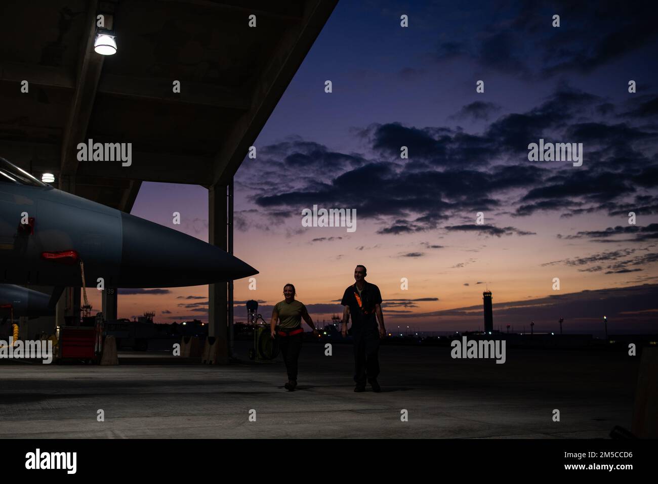 Senior Airman Baylee Koke, left, and Senior Airman Justin Neal, right