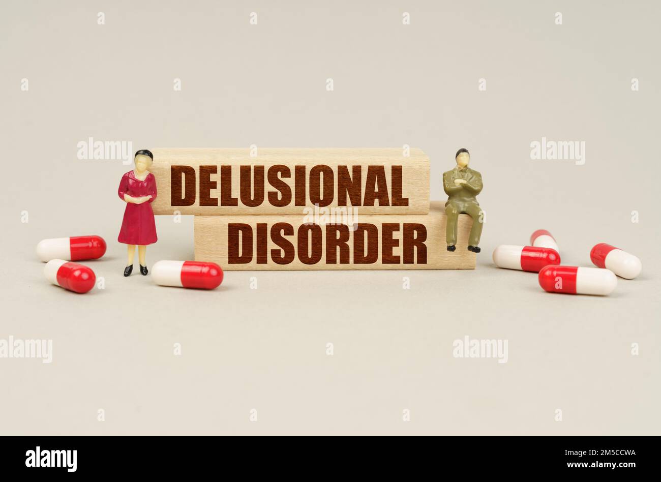 Disorder Blocks Medical concept. Next to the miniature figurines of people are tablets ...