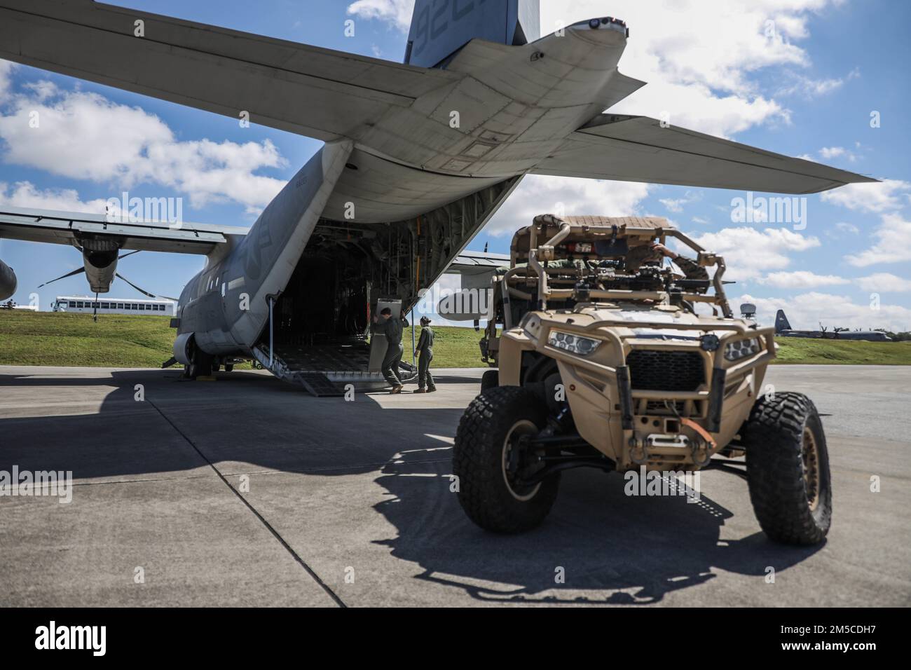 U.S. Marines with 3d Reconnaissance Battalion, 3d Marine Division load