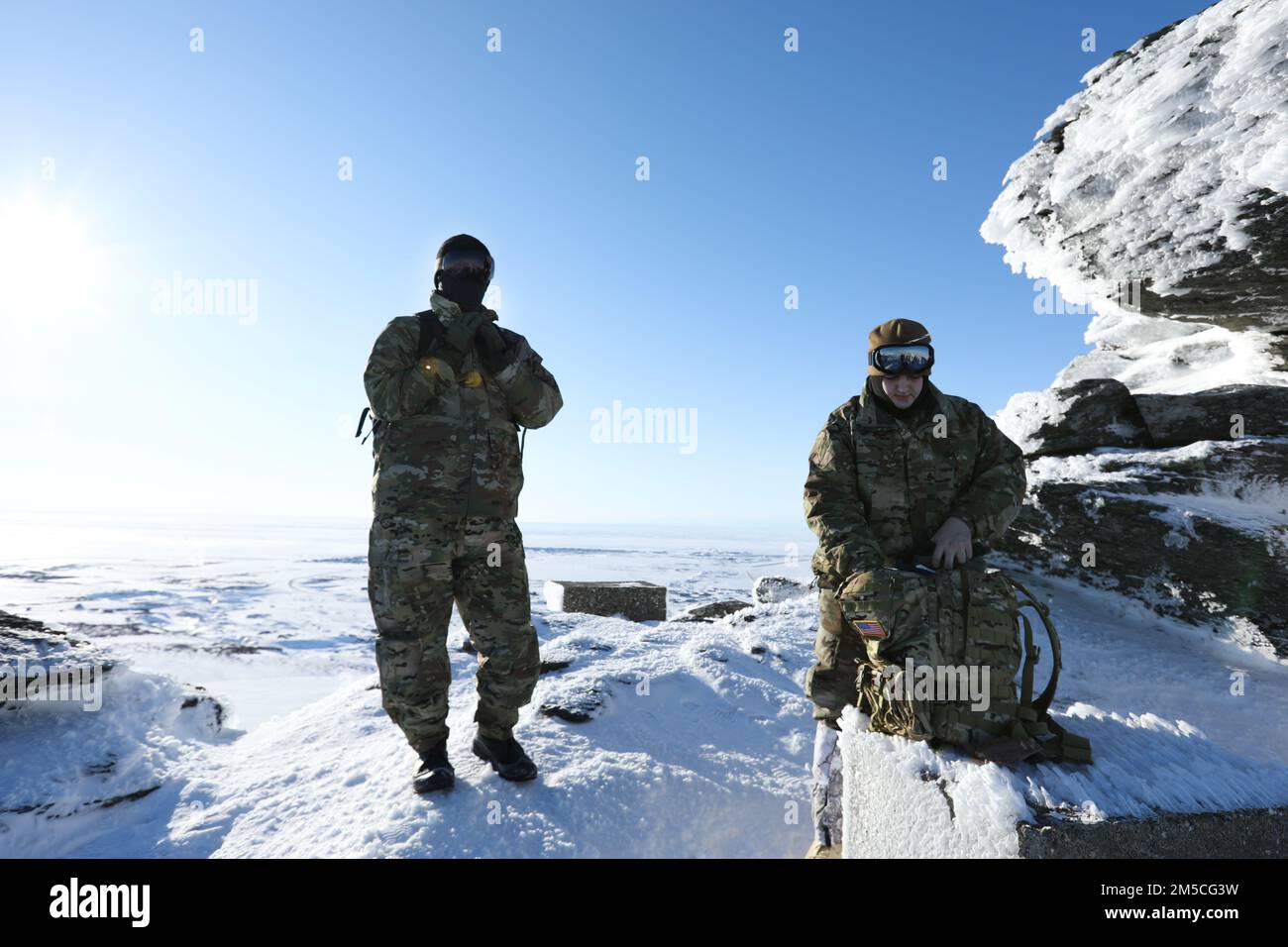 Pvt. Stanley Rodeski (left) and Pvt. Benjamin Glenn, service members with the Alaska State Defense Force, survey the outskirts of Nome for a domain awareness exercise, Mar. 1. Alaska Exercise Arctic Eagle-Patriot 2022 increases the National Guard’s capacity to operate in austere, extreme cold-weather environments across Alaska and the Arctic region. AEP22 enhances the ability of military and civilian inter-agency partners to respond to a variety of emergency and homeland security missions across Alaska and the Arctic. Stock Photo