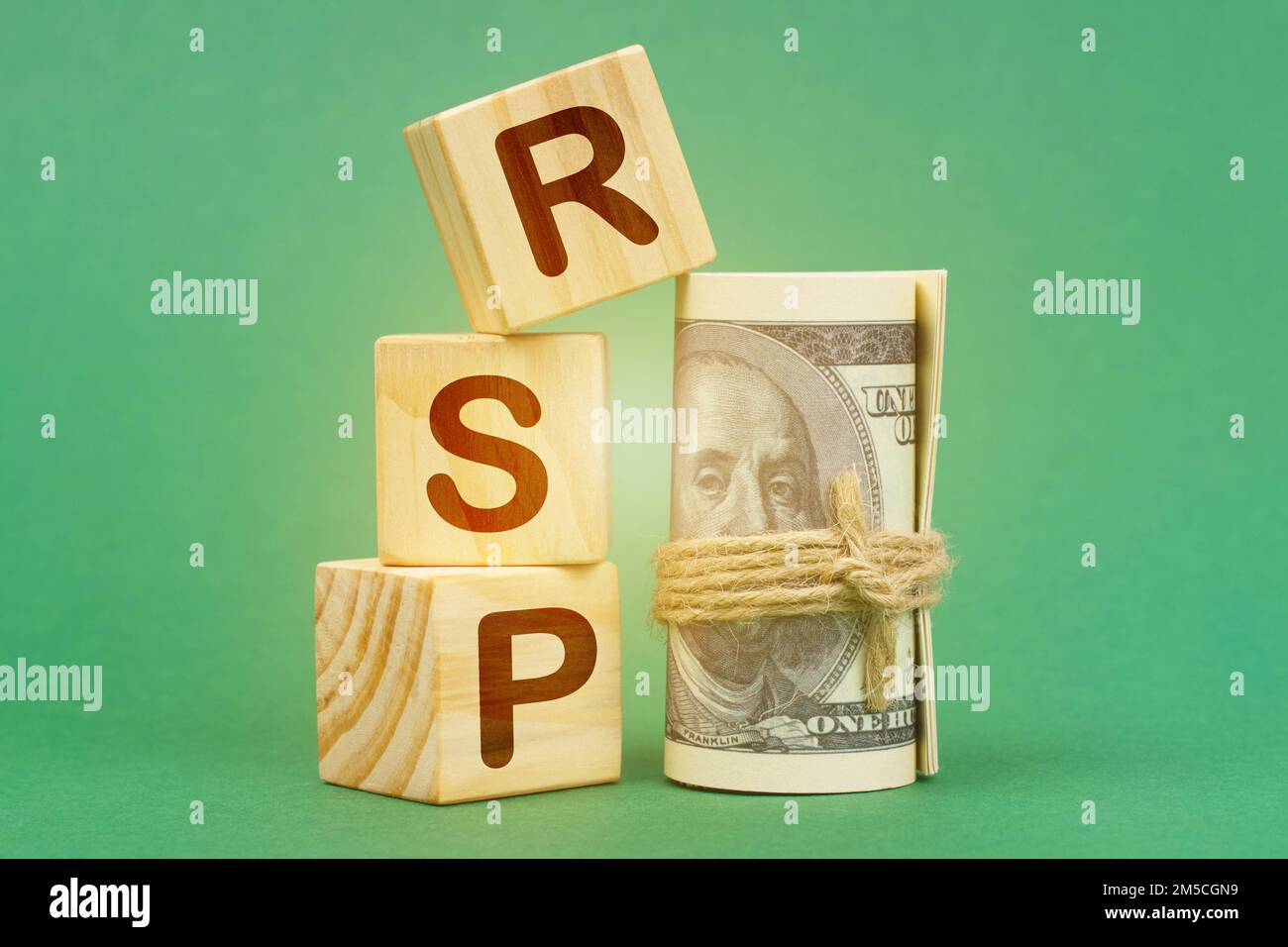 Business concept. On a green surface, dollars and cubes with the inscription - RSP Stock Photo