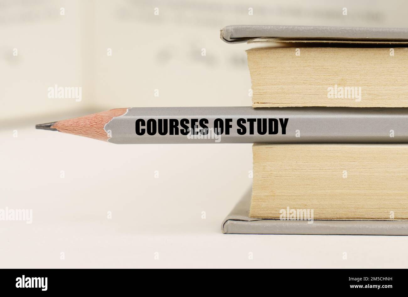 Education concept. In the book between the pages lies a pencil with the inscription - Courses of study Stock Photo